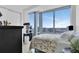 Bright bedroom with floor-to-ceiling windows and a scenic city view at 150 E Robinson St # 2002, Orlando, FL 32801