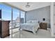 Bedroom with large windows overlooking the city, elegant wallpaper, and a comfortable bed at 150 E Robinson St # 2002, Orlando, FL 32801