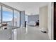Bright bedroom with floor-to-ceiling windows offering city views, and stylish decor at 150 E Robinson St # 2002, Orlando, FL 32801