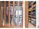 Large walk-in closet with built-in shelving and glass-front cabinets at 150 E Robinson St # 2002, Orlando, FL 32801