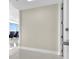 Hallway leading to a living room with seating and a view of the city at 150 E Robinson St # 2002, Orlando, FL 32801