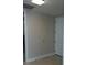 Neutral hallway featuring a coat closet and entry door, offering functionality and clean design at 150 E Robinson St # 2002, Orlando, FL 32801
