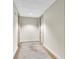 Well-lit hallway featuring neutral walls, carpet, and modern doors, creating a clean and inviting atmosphere at 150 E Robinson St # 2002, Orlando, FL 32801
