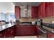 Modern kitchen with stainless steel appliances and dark granite countertops at 150 E Robinson St # 2002, Orlando, FL 32801