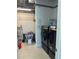 Well-equipped laundry room with modern washer, dryer, storage shelves, and ample space at 150 E Robinson St # 2002, Orlando, FL 32801