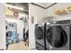 Laundry room with a washer and dryer and shelving and storage at 150 E Robinson St # 2002, Orlando, FL 32801