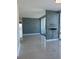 Open-concept living room with tile floors, modern wall accents, and scenic views through expansive windows at 150 E Robinson St # 2002, Orlando, FL 32801