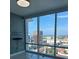 Stunning city views from this condo's living room featuring floor-to-ceiling windows and modern fixtures at 150 E Robinson St # 2002, Orlando, FL 32801