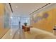 Spacious lobby with modern art, wood accents, and a view of the outdoors at 150 E Robinson St # 2002, Orlando, FL 32801