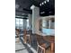 Resident lounge featuring bar with community tables and chairs for gathering and socializing at 150 E Robinson St # 2002, Orlando, FL 32801