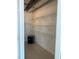 Large walk-in closet featuring custom shelving, and a safe, perfect for organized storage at 150 E Robinson St # 2002, Orlando, FL 32801