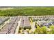 Beautiful aerial view of a modern neighborhood near a lush green forest and community playground at 15959 Pantuso Aly, Winter Garden, FL 34787