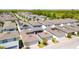 Aerial view of a residential neighborhood showing similar styled homes with attached garages at 15959 Pantuso Aly, Winter Garden, FL 34787