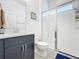Bathroom with a glass door shower and gray vanity at 15959 Pantuso Aly, Winter Garden, FL 34787
