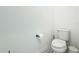 Clean bathroom featuring white walls, decorative floor tiling, and a toilet at 15959 Pantuso Aly, Winter Garden, FL 34787