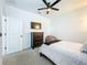 Bedroom featuring a bed, dresser, ceiling fan and natural light at 15959 Pantuso Aly, Winter Garden, FL 34787