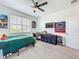 Bedroom with a green bed, a work desk, and a Chicago Bears flag at 15959 Pantuso Aly, Winter Garden, FL 34787