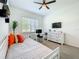 Bright bedroom featuring a daybed, desk, and ample natural light from the window at 15959 Pantuso Aly, Winter Garden, FL 34787