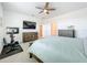 This bedroom offers a ceiling fan, neutral walls, carpet flooring, and plenty of space at 15959 Pantuso Aly, Winter Garden, FL 34787