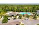Resort-style community pool with splashpad, poolside cabana, lounge chairs, and ample seating at 15959 Pantuso Aly, Winter Garden, FL 34787