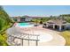 Resort-style community pool featuring splashpad, cabana, lounge chairs, and verdant landscaping at 15959 Pantuso Aly, Winter Garden, FL 34787