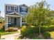 Charming two-story home with landscaped yard and walkway leading to covered front porch at 15959 Pantuso Aly, Winter Garden, FL 34787