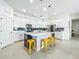 Spacious kitchen featuring an island with bar seating, a microwave, and stainless refrigerator at 15959 Pantuso Aly, Winter Garden, FL 34787