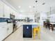 Modern kitchen featuring an island, stainless appliances, and sleek cabinetry with dining area at 15959 Pantuso Aly, Winter Garden, FL 34787