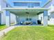 Wide view of the covered patio showing pavers, seating, ceiling fan, and grill at 15959 Pantuso Aly, Winter Garden, FL 34787