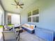 Covered patio featuring comfortable seating, ceiling fan, and storage at 15959 Pantuso Aly, Winter Garden, FL 34787