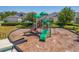 Community playground with multiple slides, climbing structures, and a wood chip surface in a Gathering-friendly neighborhood at 15959 Pantuso Aly, Winter Garden, FL 34787