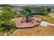 Community playground with multiple slides, climbing structures, and a lush landscaped surround at 15959 Pantuso Aly, Winter Garden, FL 34787