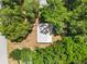 Overhead aerial shot showcases the home's roof and surrounding mature trees at 1650 Old Eustis Rd, Mount Dora, FL 32757