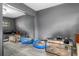 Bedroom with mirrored closet doors and gray walls showcasing storage space, reflecting natural light and creating an open feel at 1650 Old Eustis Rd, Mount Dora, FL 32757