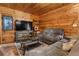 Comfortable living room featuring a large TV, plush seating, and stylish decor at 1650 Old Eustis Rd, Mount Dora, FL 32757