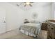 Cozy bedroom with hardwood floors, natural light, and calming, neutral accents at 17226 Hickory Wind Dr, Clermont, FL 34711