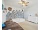 This bedroom has light-colored walls and interesting wall decor at 17226 Hickory Wind Dr, Clermont, FL 34711