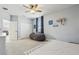 Comfortable bedroom featuring a ceiling fan, a beanbag chair, and closet storage space at 17226 Hickory Wind Dr, Clermont, FL 34711