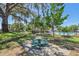 Scenic view of community picnic area, pool, lush trees and manicured lawn at 17226 Hickory Wind Dr, Clermont, FL 34711