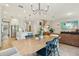 Open-concept dining area flows into kitchen and living room at 17226 Hickory Wind Dr, Clermont, FL 34711