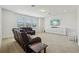 Relaxing living room with a ceiling fan, carpet flooring, and modern furniture at 17226 Hickory Wind Dr, Clermont, FL 34711