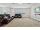 Spacious living room with plush carpeting, recessed lighting, and comfortable, modern seating at 17226 Hickory Wind Dr, Clermont, FL 34711