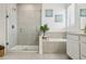 Beautiful main bathroom features a walk-in shower and a separate soaking tub at 17226 Hickory Wind Dr, Clermont, FL 34711