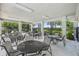 Beautiful outdoor patio area with tables, seating and picturesque garden views at 17226 Hickory Wind Dr, Clermont, FL 34711