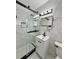 Modern bathroom featuring a glass enclosed shower with marble-style tile and a sleek vanity at 2007 N Hastings St, Orlando, FL 32808