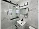 Modern bathroom featuring a glass enclosed shower with marble-style tile and a sleek vanity at 2007 N Hastings St, Orlando, FL 32808