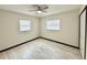 This bedroom offers light grey wood-look floors and a ceiling fan at 2007 N Hastings St, Orlando, FL 32808