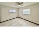 Bright bedroom with wood-look flooring, ceiling fan, and neutral walls at 2007 N Hastings St, Orlando, FL 32808