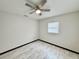 Bright bedroom with wood-look flooring, ceiling fan, and neutral walls at 2007 N Hastings St, Orlando, FL 32808