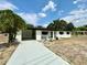 Inviting exterior view of a single-Gathering home with a long driveway and carport at 2007 N Hastings St, Orlando, FL 32808